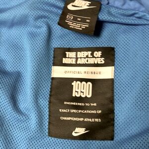 Blue and gray Nike zip up hoodie from the department of Nike archives